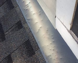 Damaged roof to wall flashing